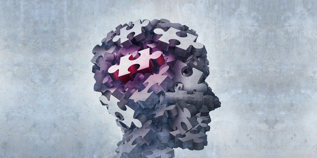 Three-dimensional illustration of puzzle pieces forming the shape of a human head to illustrate the concept of mental disorder and psychosis.